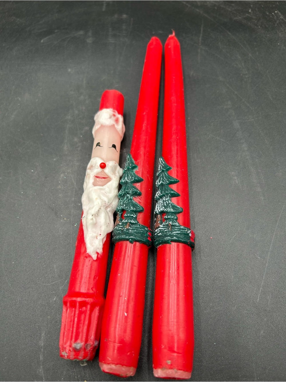 Vintage candles with Christmas trees and Santa